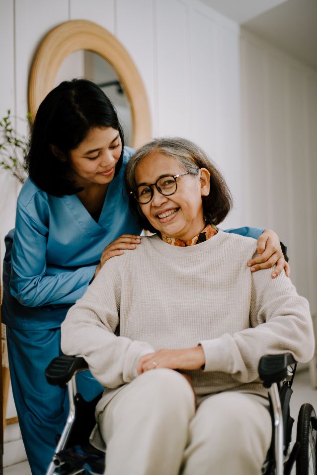 caregiver with elderly in wheelchair